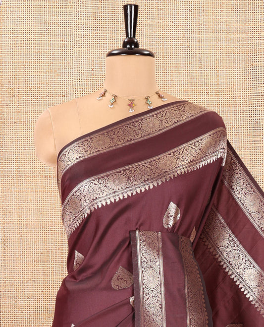 Brown Kanchi Soft Silk Saree, Elevated with Zari Buttas All Over Its Body, Highlighted by Traditional Zari Rettai Pettu Chakram Border, Intricately Designed Jaal Pallu, and Paired with a Matching Blouse