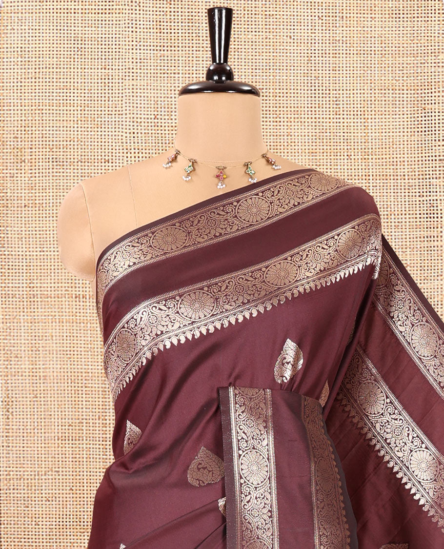 Brown Kanchi Soft Silk Saree, Elevated with Zari Buttas All Over Its Body, Highlighted by Traditional Zari Rettai Pettu Chakram Border, Intricately Designed Jaal Pallu, and Paired with a Matching Blouse
