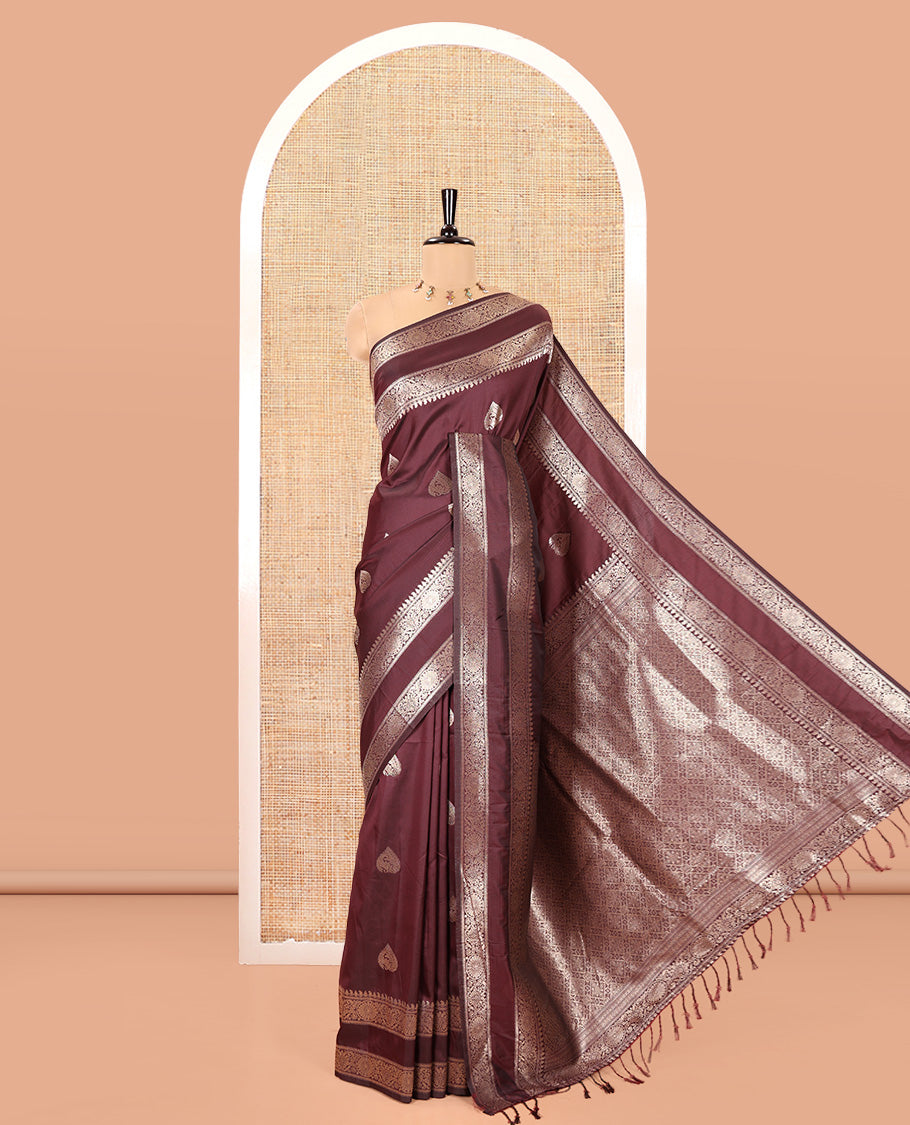 Brown Kanchi Soft Silk Saree, Elevated with Zari Buttas All Over Its Body, Highlighted by Traditional Zari Rettai Pettu Chakram Border, Intricately Designed Jaal Pallu, and Paired with a Matching Blouse