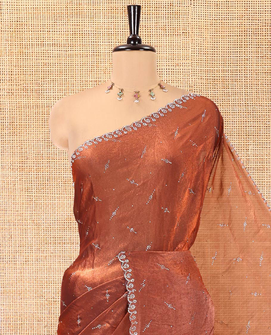 Maroon Fendy Chiffon Saree, Highlighted by Swarovski Stone Work All Over the Body, Gleaming Swarovski Stone Work Border, a Self-Pallu, and Paired with a Fancy Designer Blouse