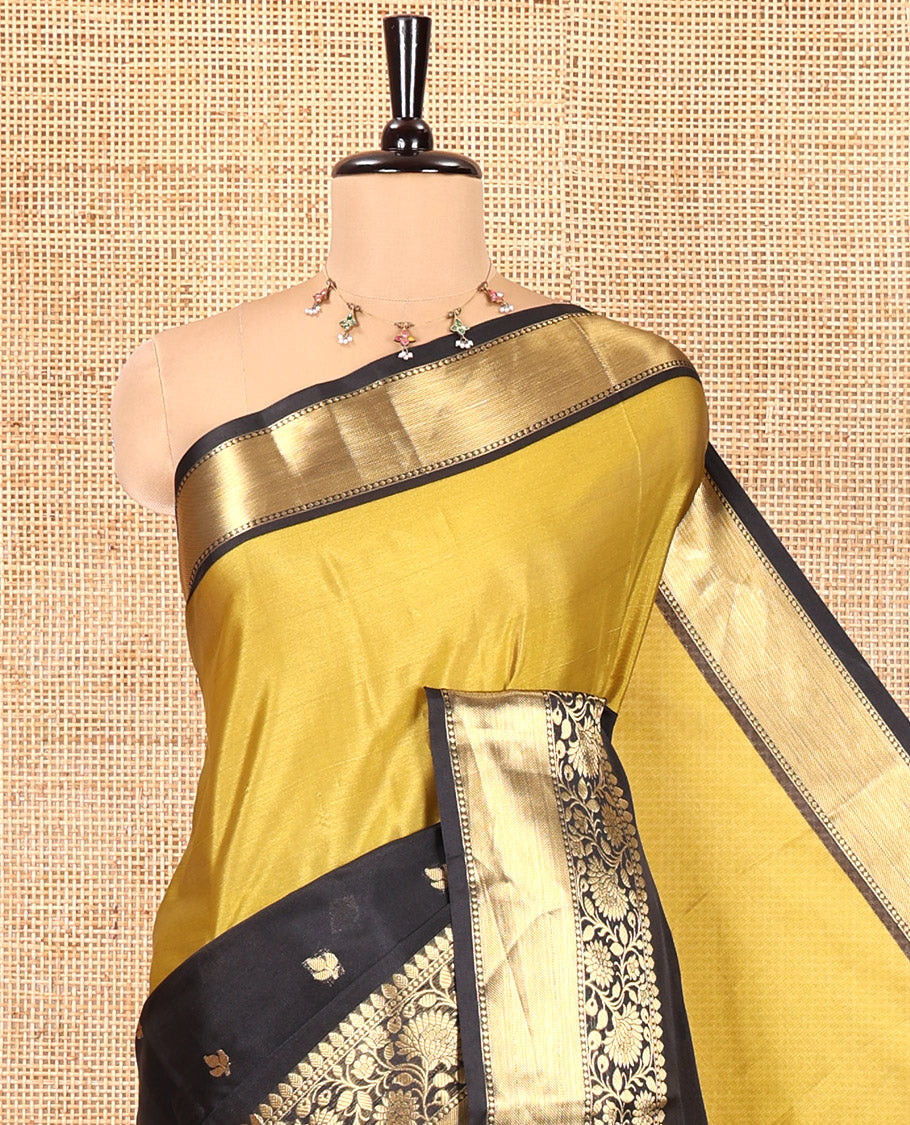 Mehendi and Black Banarasi Tissue Saree, Adorned with Half-And-Half-Style and Zari Buttas All Over Its Body, Complemented by a Contrast Traditional Zari Design Border, a Self-Pallu, and Paired with a Matching Blouse
