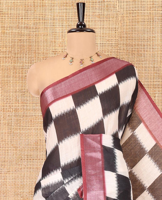 Black and White Linen Cotton Saree, Uniquely Printed with Chess-Style Checked Design on Its Body, Complemented by a Contrast Zari Border, Chevron Design Pallu, and Paired with a Contrast Blouse