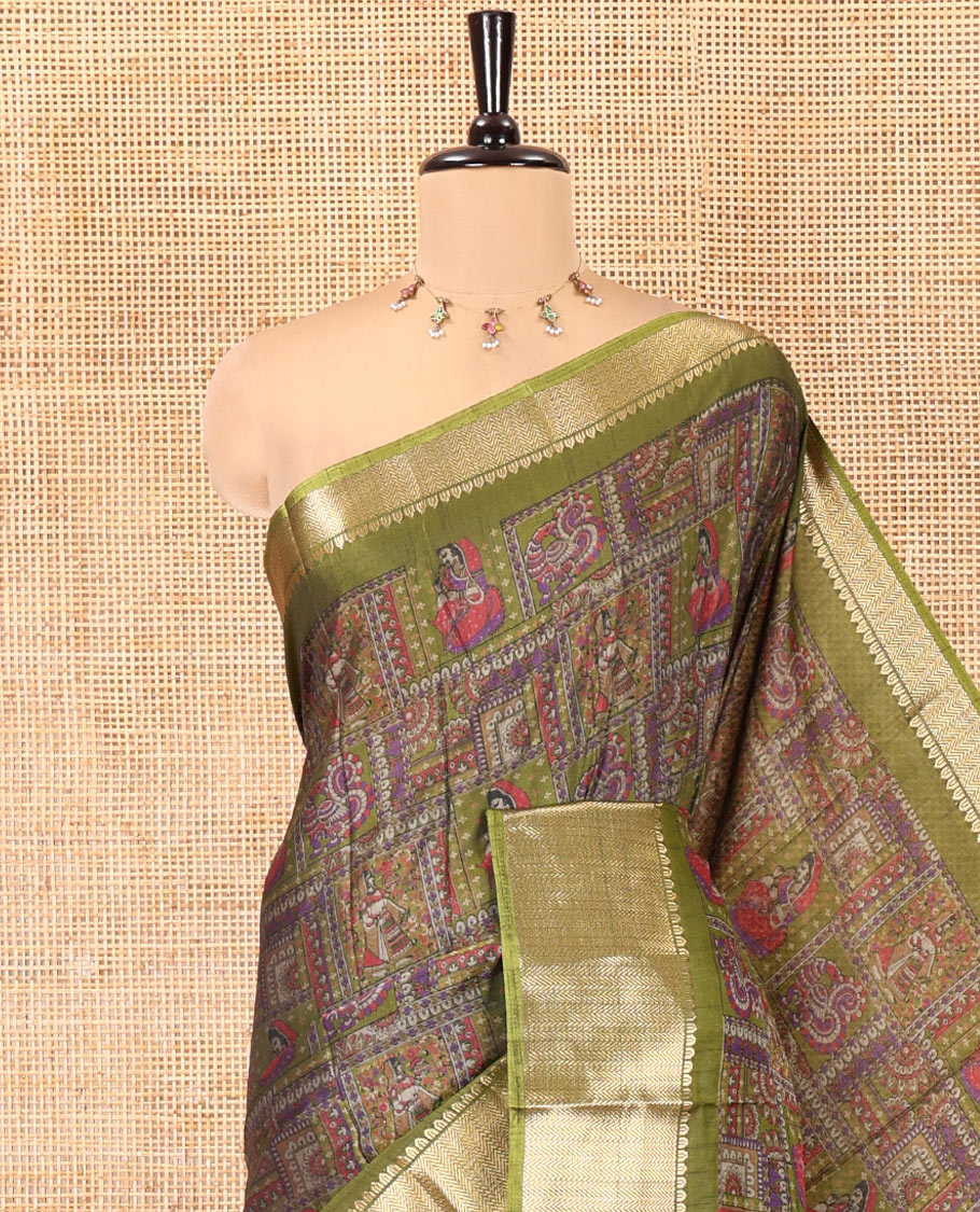 Olive Green Dola Silk Saree, Accentuated with Kalamkari-Style Peacock and Human Motifs Printed on Its Body, Highlighted by a Traditional Zari Design Border, a Self-Printed Pallu, and Paired with a Matching Blouse
