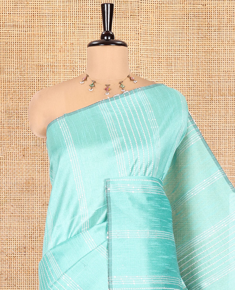Borderless Teal Green Semi-Raw Silk Saree, Decorated with Sequined Stripes, a Contrast Zari Striped Pallu, and Contrast Blouse