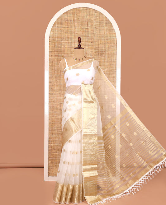 Cream Semi-Organza Saree, Masterfully Woven with Zari Buttas, Highlighted by a Zari Paisley Border, and a Matching Blouse