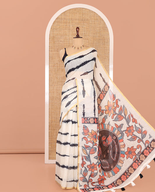 Cream Linen Cotton Saree, Adorned with Shibori Print, a Zari Piping Border, Floral-Peacock Motif Printed Pallu, and Matching Blouse