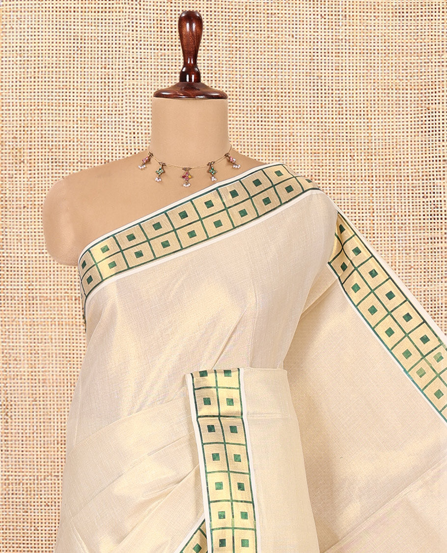 Gold-Green Plain Kerala Tissue Saree Features a Butta Enclosed Checked Border, and a Matching Blouse