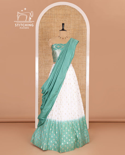 White-pista green half-saree, zari buttas with contrast bordered nylon viscose crepe skirt, a jaal jacquard design Vichitra silk blouse, and a contrast striped Vichitra silk dhavani