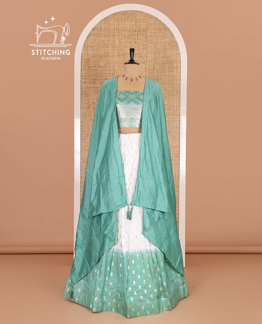 White-pista green half-saree, zari buttas with contrast bordered nylon viscose crepe skirt, a jaal jacquard design Vichitra silk blouse, and a contrast striped Vichitra silk dhavani