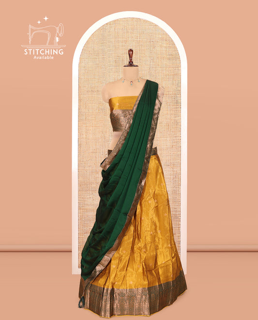 Yellow-Green Shimmer Tissue Half-Saree Features Buttas Skirt, a Contrast Traditional Border, a Matching Blouse, a Contrast Dhavani