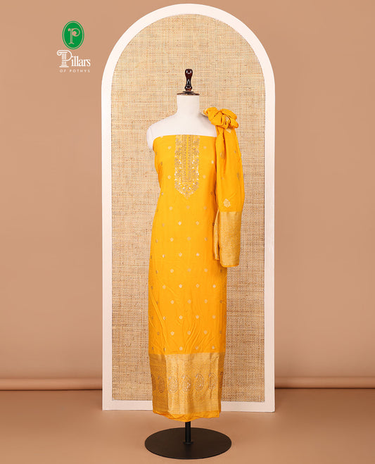 Mango yellow banaras semi-silk chudidar material set, floral zari buttas & stonework top,plain santoon bottom & gold zari design dupatta