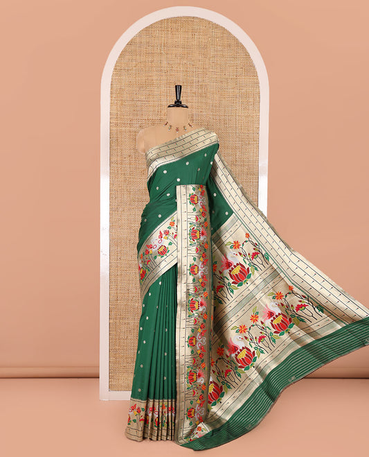 Bottle green floral buttas art silk paithani saree, contrast floral, bird, and muniya border, pallu of floral and bird designs and a matching blouse