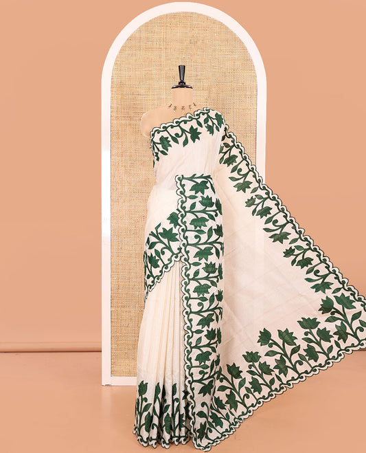 Cream and Green Plain Fancy Kota Silk Saree Highlighted with Lotus Floral Applique Embroidered Scallop Border, Lotus Motifs Applique Embroidered Pallu, and a Contrast Plain Blouse