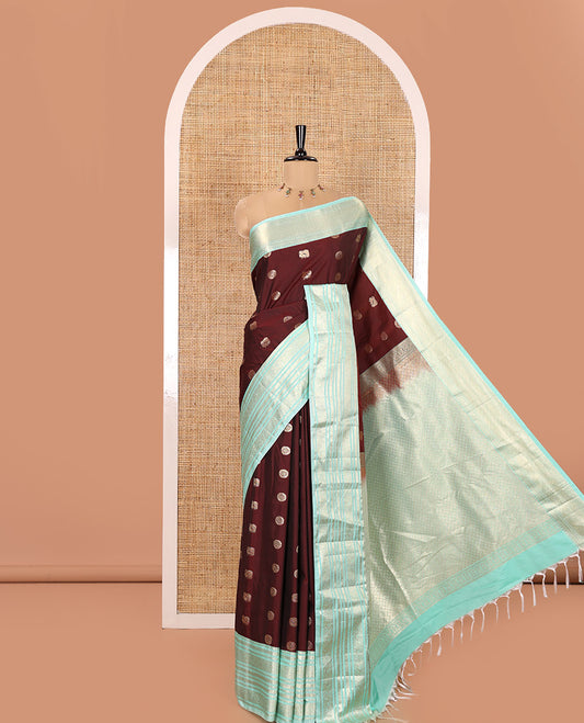 Maroon Kanchipuram Budget Silk Saree, Adorned with Peacock Chakram Buttas All Over Its Body, Complemented by a Contrast Traditional Zari Border of Floral-Bird Designs, Pallu Enriched with Geometric Patterns, and Paired with a Matching Blouse