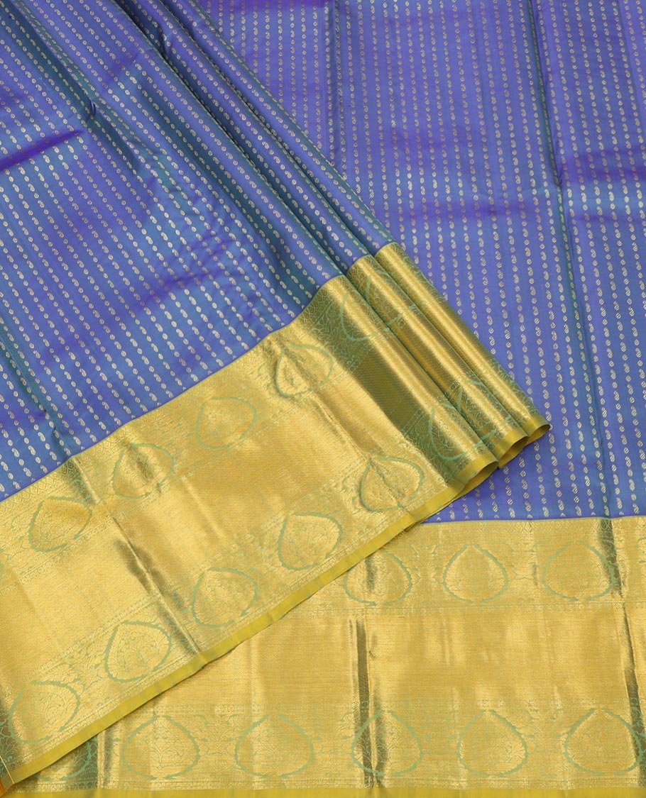 Blue Pure Silk Half-Saree, Detailed with Zari Buttas All Over Its Skirt, Complemented by Contrast Traditional Zari Design Border, Paired with a Contrast Blouse, and Comes with a Jaal Design Dhavani