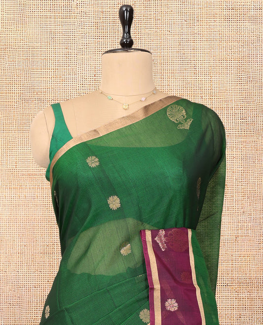 Green Cotton Saree, Enriched with Floral Buttas, a Contrast One-Side Big Floral Zari Butta Border, a Jaal Pallu, and a Contrast Blouse