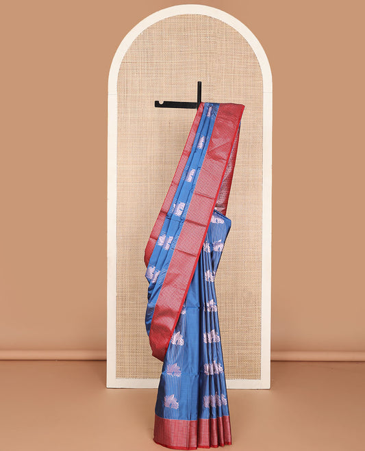 Blue semi-soft silk saree with zari stripes & leaf design, contrast zari checked border & ogee patterned pallu