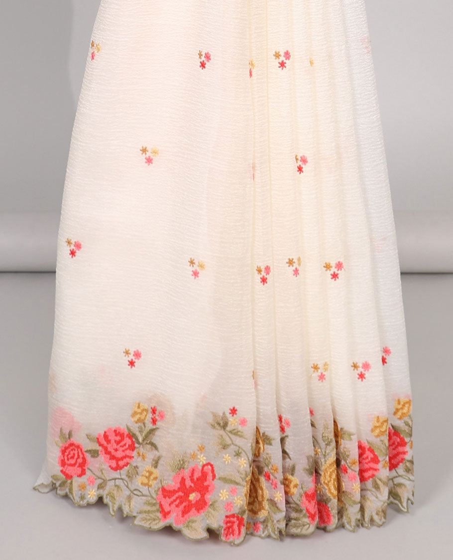 Yellow crushed tissue saree with scallop floral border & motif embroidery pallu