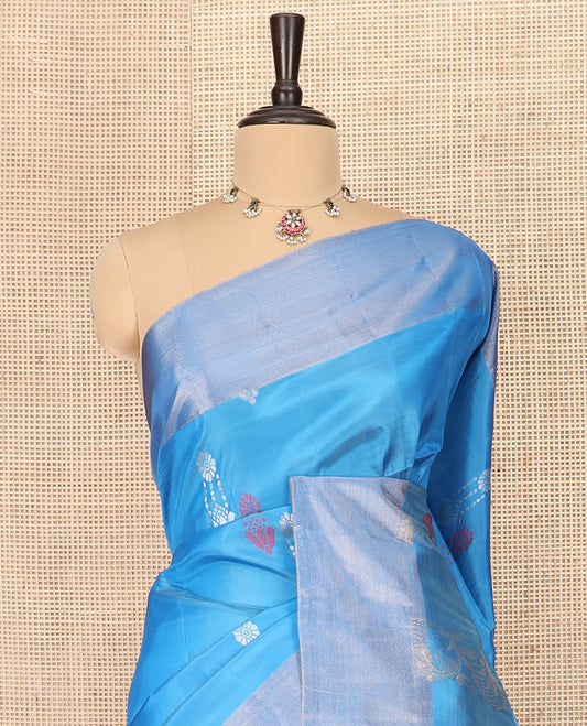 Blue Semi Uppada Saree Subtly Sparkled with Zari Buttas, Complemented by a Bavanji Border, Contrasting Pallu of Intricate Zari Designs, and Paired with a Contrast Blouse