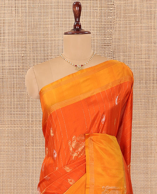 Orange Uppada Silk Saree Decked Up with Paisley and Peacock Buttas All Over Its Body, Complemented by Contrast Border of Peacock Designs, Sparsely Sparkled Pallu of Jaal Designs, and Paired with a Contrast Blouse