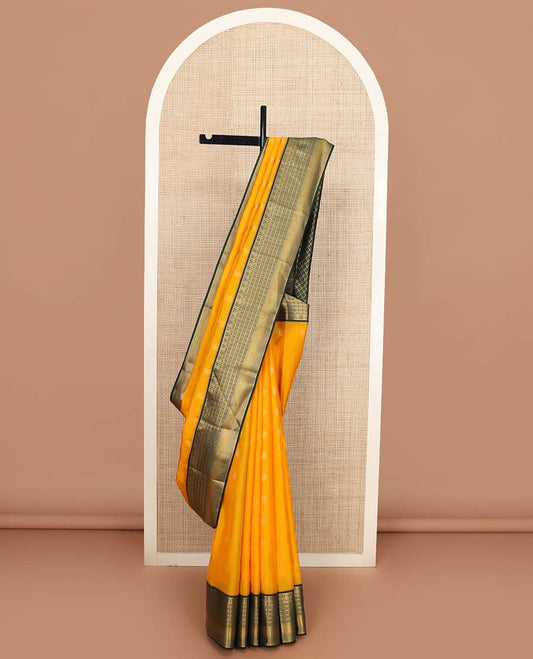Yellow manga buttas Vasundhara silk mix saree, contrast geometric patterned zari border, and leaf motifs steeped pallu