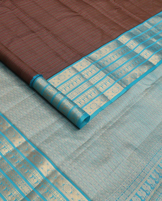 Brown striped Vasundhara silk mix saree, contrast border of muthu, paisa, and mayil designs, and jaal pallu