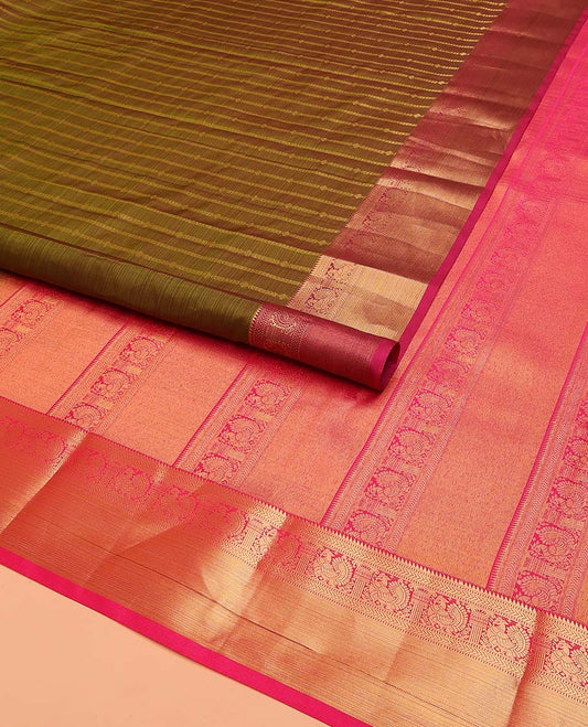 Green Vasundhara Lite Silk Mix Saree Decked Up with Zari Stripes, Complemented with a Contrast Border Featuring Rekku, Muthu, Kathir, and Mayil Designs, Pallu Replicates the Same Border Designs, and Paired with a Contrast Blouse