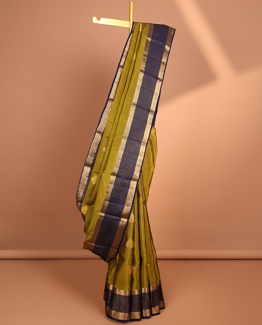 Green butta vasundhara elite silk saree with contrast zari striped border & striped, zari buttas zari design pallu