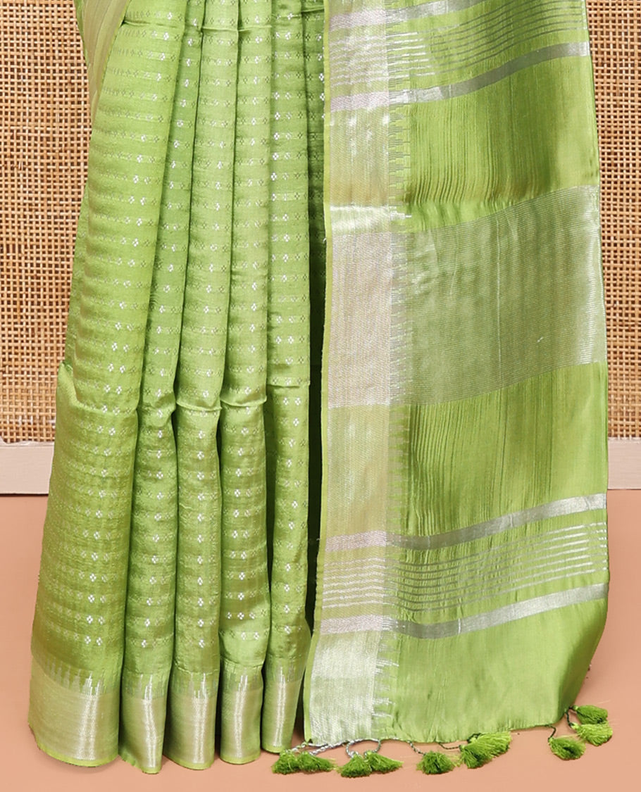 Light Green Banana Pith Saree, Lightly Embellished with Buttas All Over Its Body, Highlighted by a Zari Temple Border, Gleaming Zari Striped Pallu, and Paired with a Matching Blouse