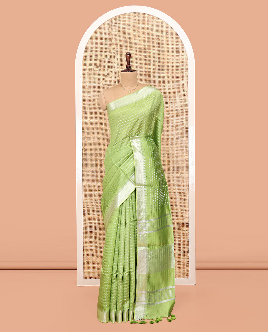 Light Green Banana Pith Saree, Lightly Embellished with Buttas All Over Its Body, Highlighted by a Zari Temple Border, Gleaming Zari Striped Pallu, and Paired with a Matching Blouse