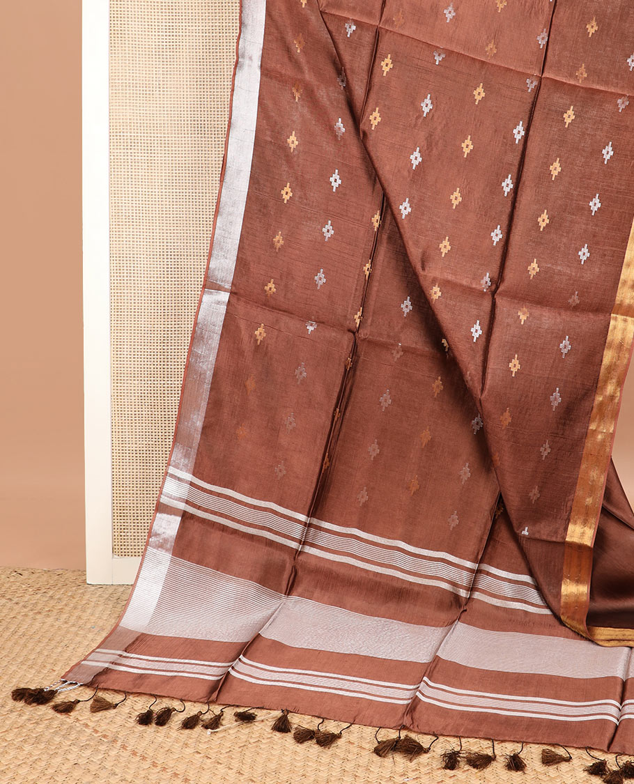Brown diamond buttas banana pith saree, silver and gold bavanji border, and zari striped pallu