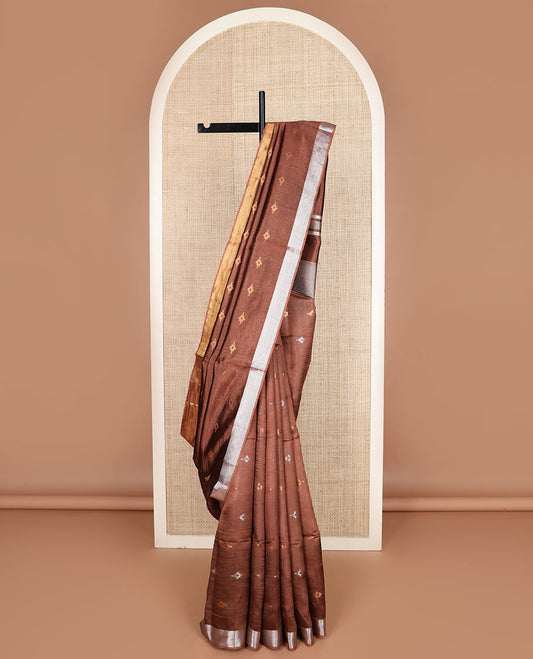 Brown diamond buttas banana pith saree, silver and gold bavanji border, and zari striped pallu