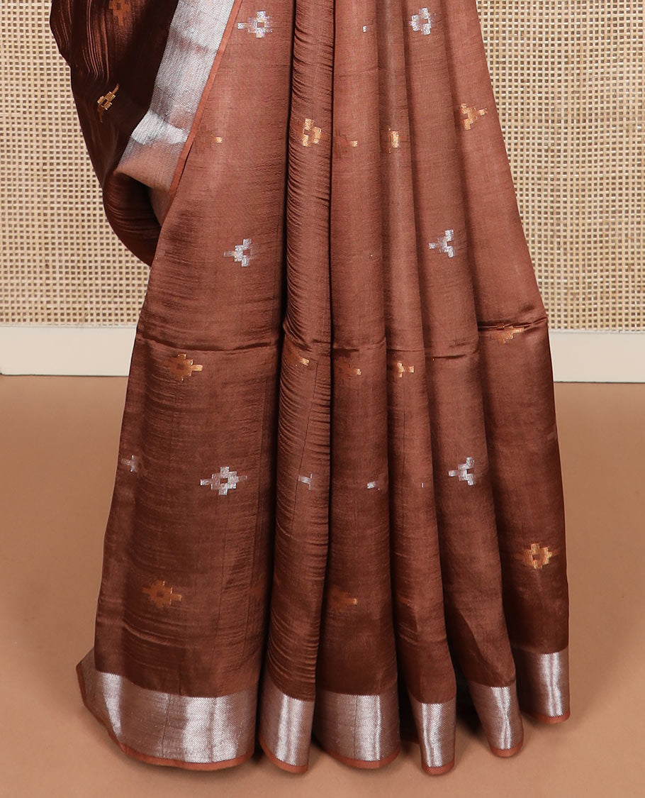 Brown diamond buttas banana pith saree, silver and gold bavanji border, and zari striped pallu