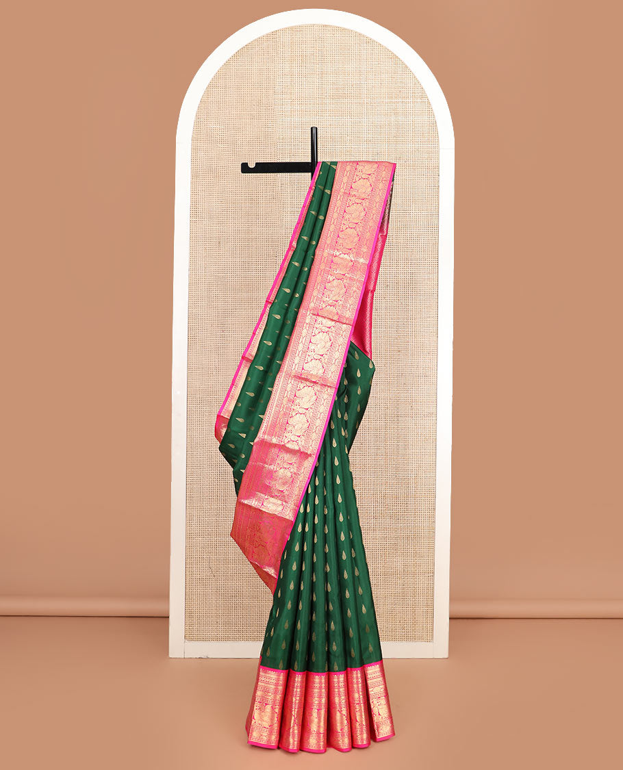 Green thilakam buttas silk saree, contrast border of rekku, muthu, kathir, neli, laddu kamalam, and mayil designs, and jaal pallu