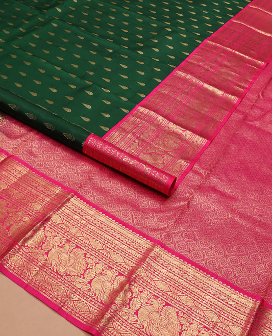 Green thilakam buttas silk saree, contrast border of rekku, muthu, kathir, neli, laddu kamalam, and mayil designs, and jaal pallu