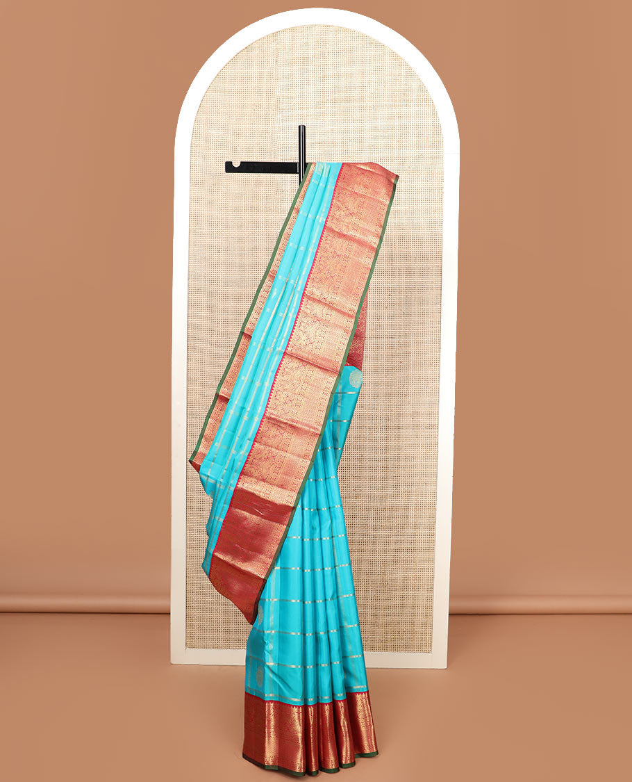 Blue butta enclosed checked silk saree, contrast border of rekku, muthu, manga, mayil, and kamalam designs, and jaal pallu