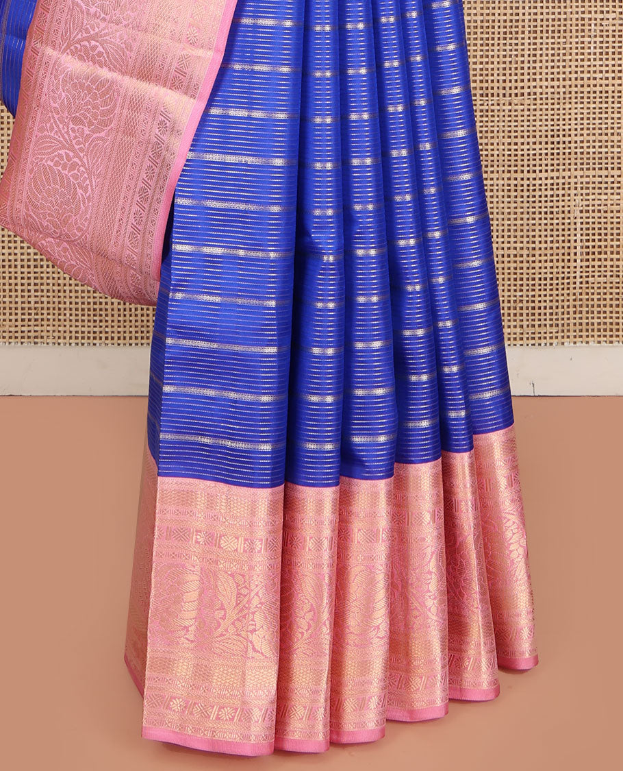 Blue Vasundhara Silk Saree, Beautifully Embellished with Zari Stripes All Over Its Body, Complemented by Contrast Border of Mayil Kann, Rudraksham, and Kodi Visiry Designs, Intricately Designed Pallu, and Paired with a Contrast Blouse