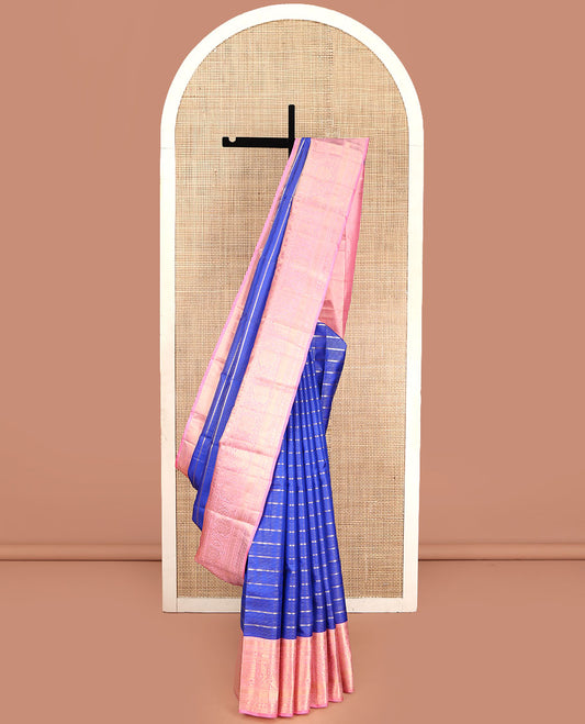 Blue Vasundhara Silk Saree, Beautifully Embellished with Zari Stripes All Over Its Body, Complemented by Contrast Border of Mayil Kann, Rudraksham, and Kodi Visiry Designs, Intricately Designed Pallu, and Paired with a Contrast Blouse