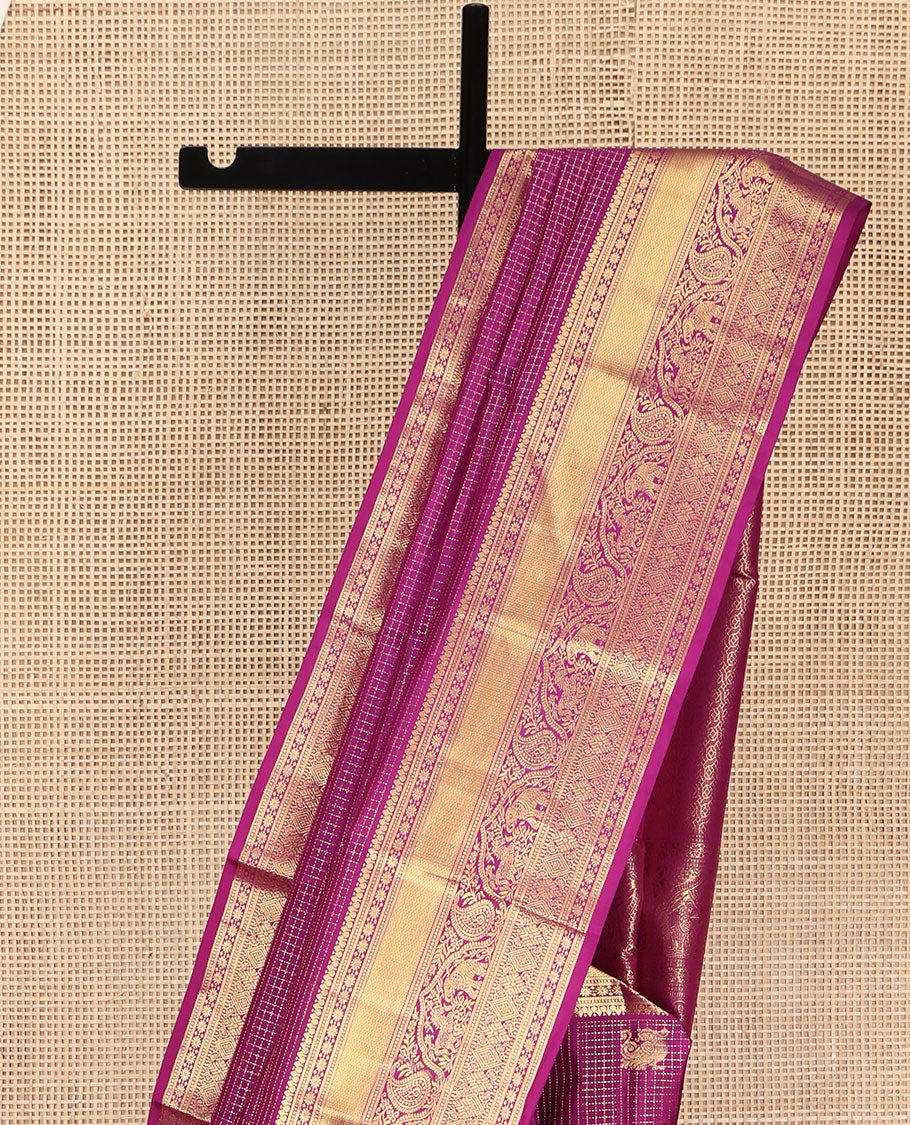 Purple Vasundhara Silk Saree, Dazzled with Zari Buttas and Zari Checks All Over Its Body, Highlighted by a Zari Border of Banaras, Muthu, Star Vanki, Manga, Kuthirai, and Yaanai Designs, Intricately Designed Pallu, and Paired with a Matching Blouse