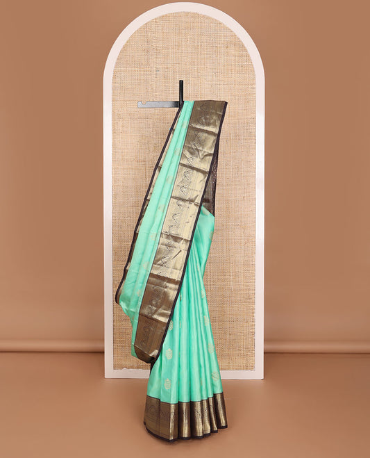 Turquoise floral buttas silk saree, contrast jaal pallu & border of rekku,manga,lavangam,kathir & zari stripes