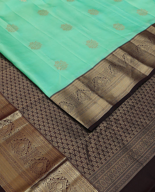 Turquoise floral buttas silk saree, contrast jaal pallu & border of rekku,manga,lavangam,kathir & zari stripes