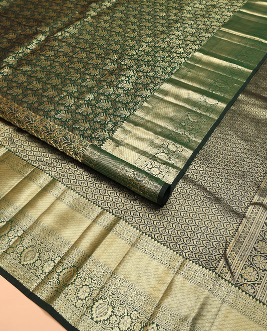 Green jacquard kanchipuram silk saree, zari border of thilakam, greek key, and kodi visiry designs, and intricate pallu