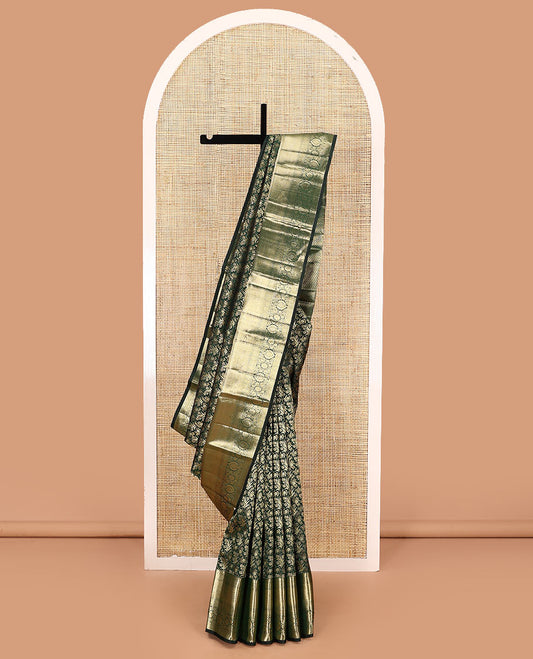 Green jacquard kanchipuram silk saree, zari border of thilakam, greek key, and kodi visiry designs, and intricate pallu