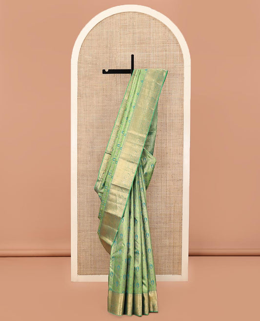 Green Kanchipuram Wedding Silk Saree, Elegantly Highlighted with Meenakari Jacquard on Its Body, Highlighted by a Zari Border of Jaal, and Arumbu Manga Designs, Grand Jaal Pallu, and Paired with a Matching Blouse