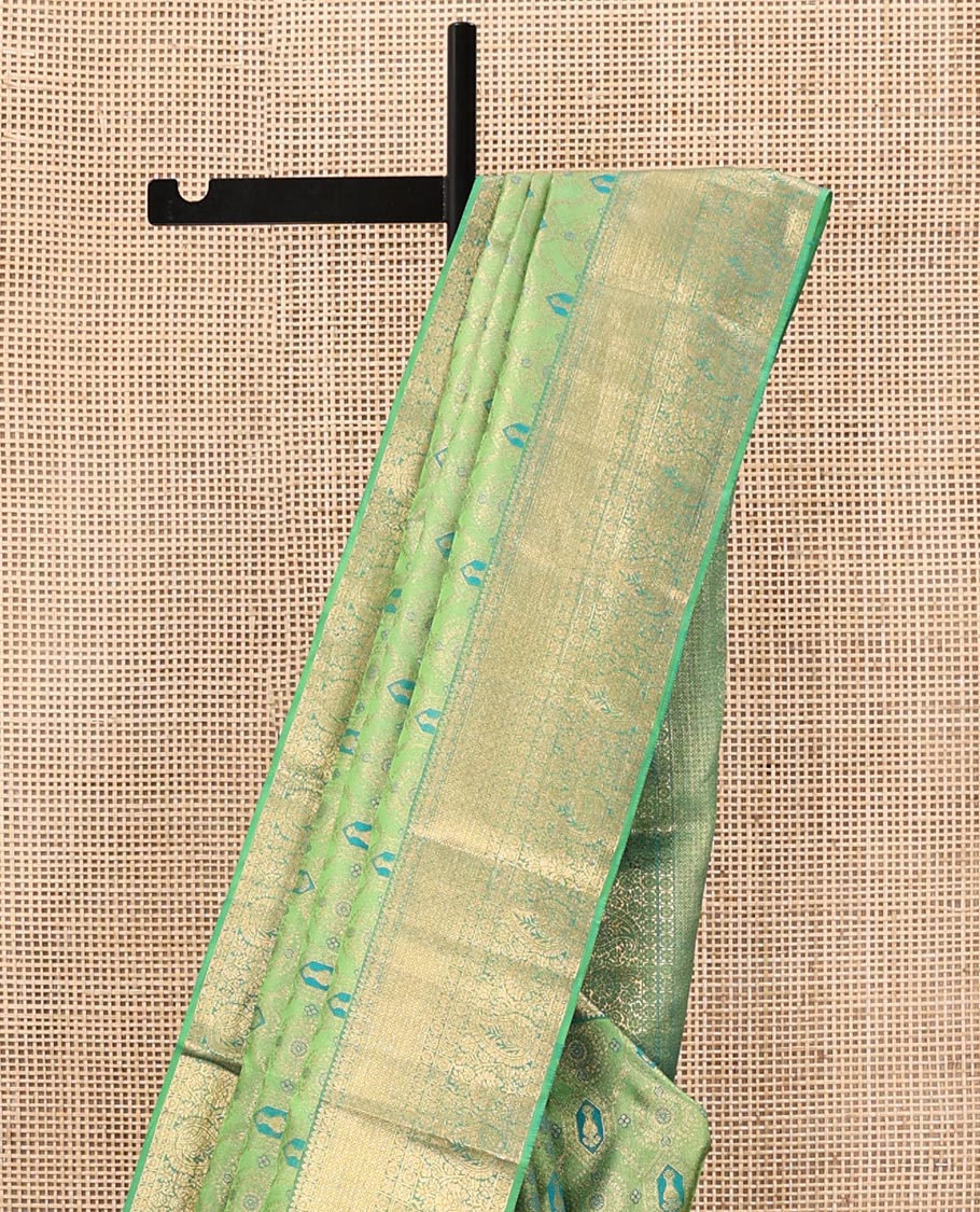 Green Kanchipuram Wedding Silk Saree, Elegantly Highlighted with Meenakari Jacquard on Its Body, Highlighted by a Zari Border of Jaal, and Arumbu Manga Designs, Grand Jaal Pallu, and Paired with a Matching Blouse