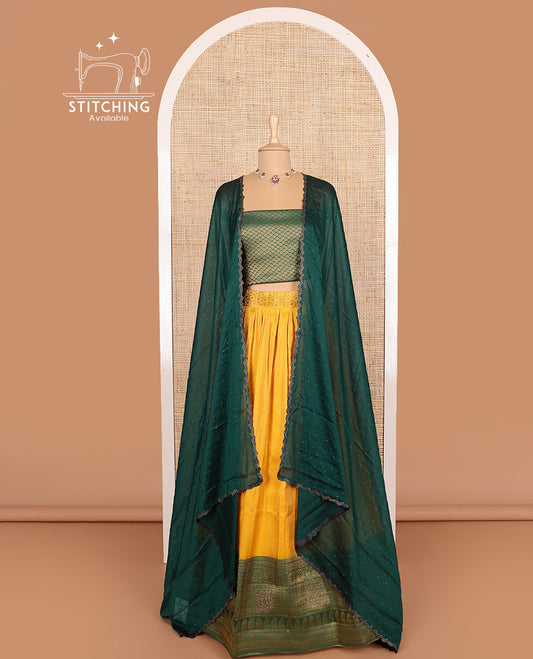 Mango yellow art silk half-saree, brocade with contrast traditional border skirt, contrast brocade blouse, scallop stone work dhavani, and detachable belt