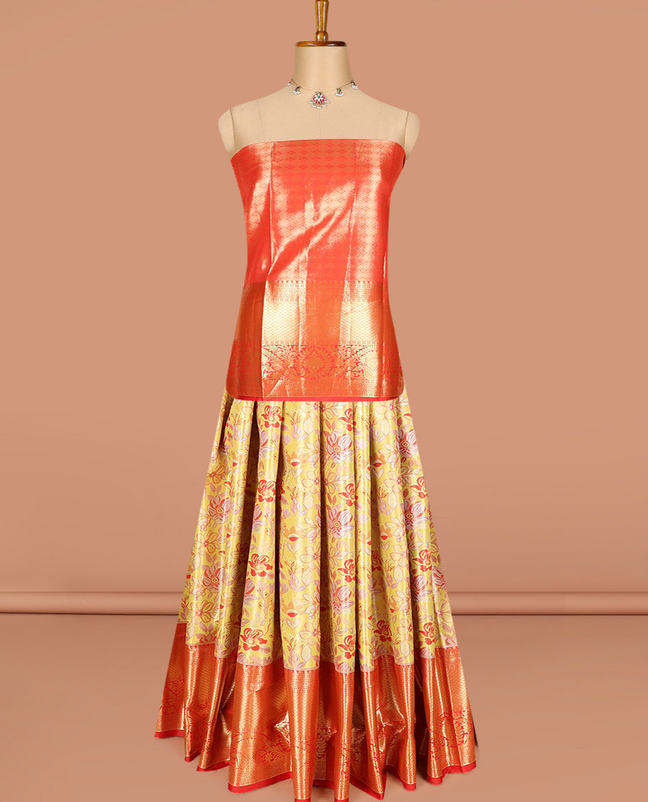 Yellow art silk half-saree pavadai material, floral jacquard with contrast traditional border skirt, jacquard blouse, and zari design dhavani
