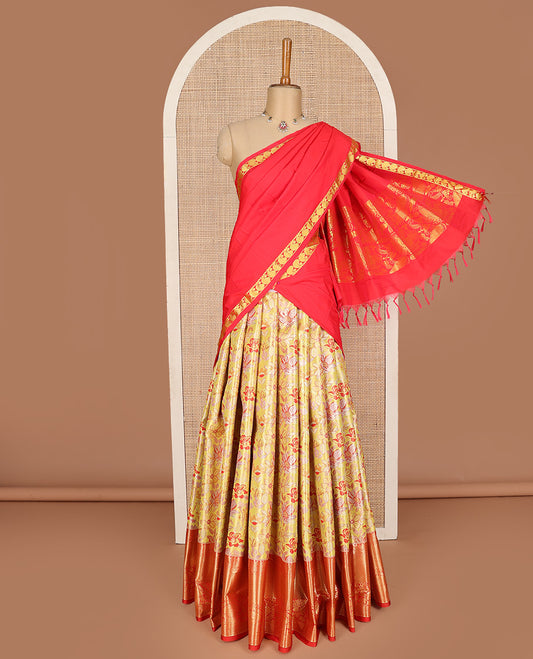 Yellow art silk half-saree pavadai material, floral jacquard with contrast traditional border skirt, jacquard blouse, and zari design dhavani