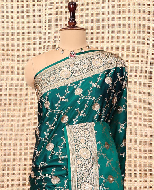 Green Banarasi Satin Saree, Embellished with Floral Jaal Jacquard, a Floral Creeper Border, Intricate Stonework Pallu, and a Matching Blouse