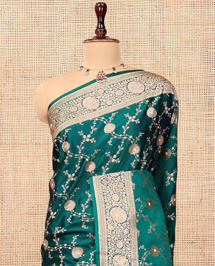 Green Banarasi Satin Saree, Embellished with Floral Jaal Jacquard, a Floral Creeper Border, Intricate Stonework Pallu, and a Matching Blouse